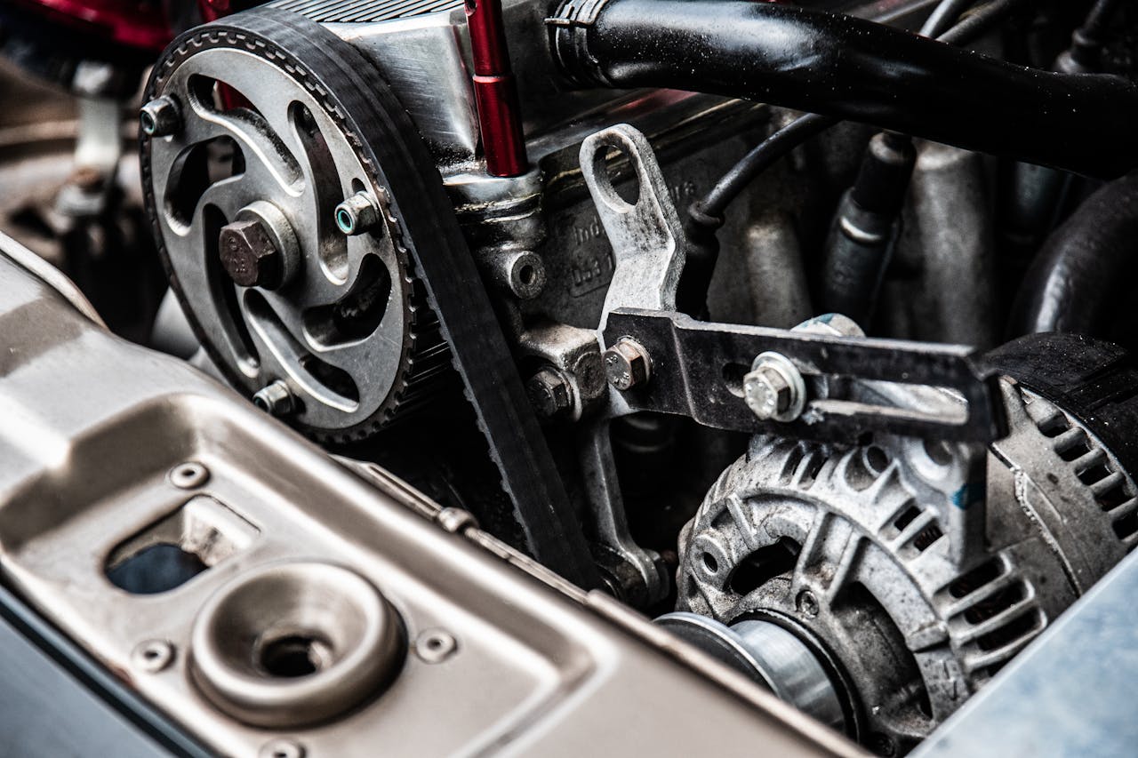 about-01 High-resolution close-up of a car engine showing intricate mechanical parts and metallic details.